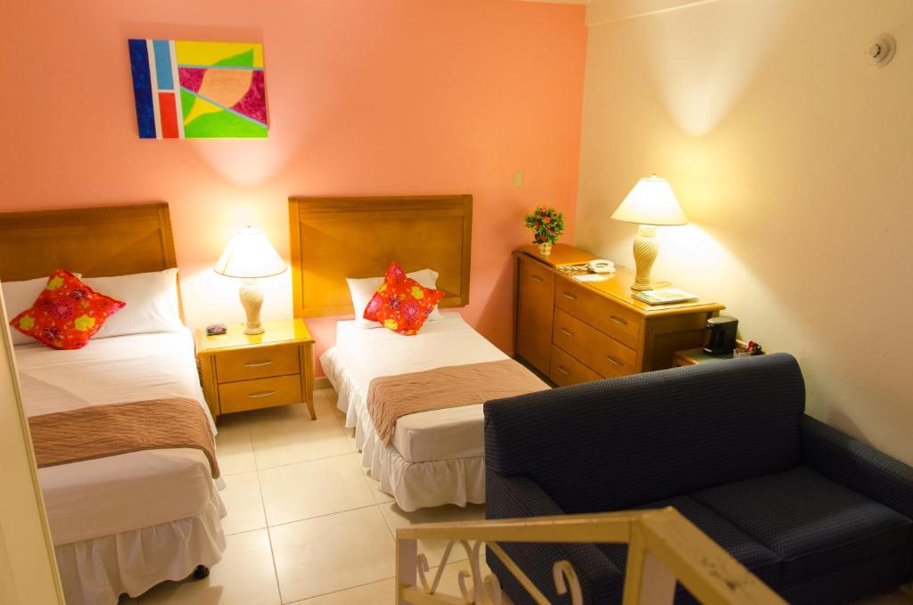 Postel nebo postele na pokoji v ubytování Alicia's Inn