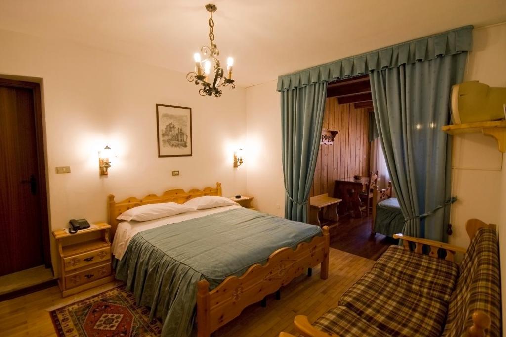 Posteľ alebo postele v izbe v ubytovaní Hotel Napoleon