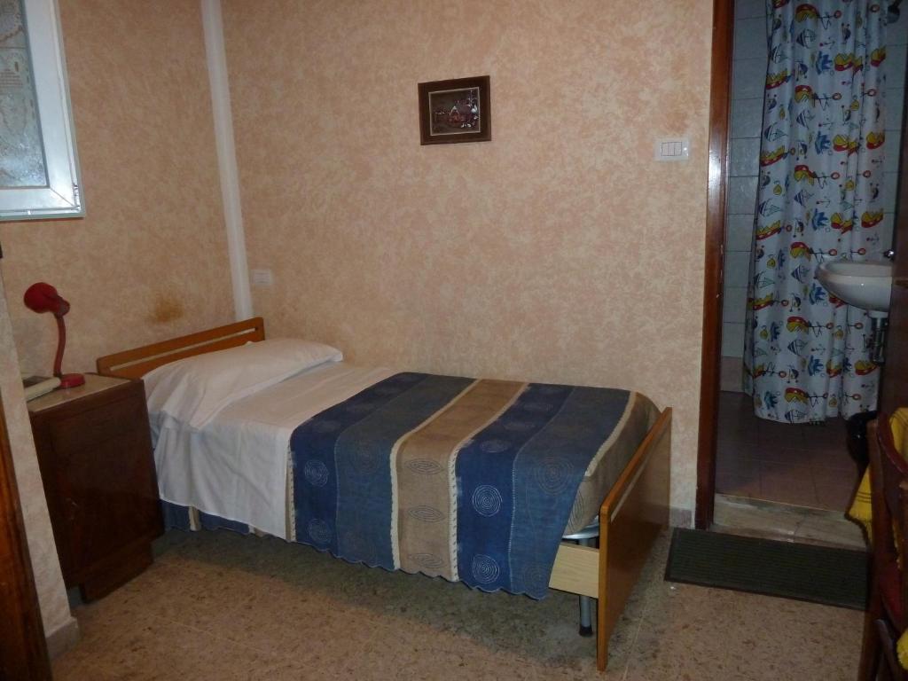 Postel nebo postele na pokoji v ubytování Hotel Bolognese