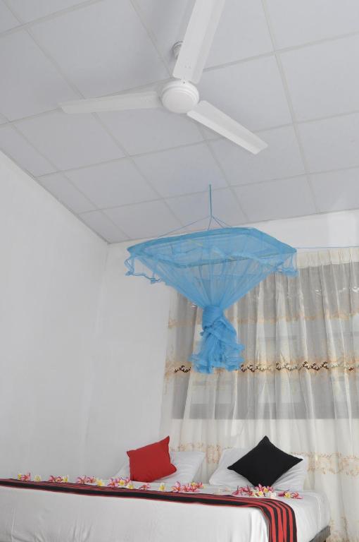 Postel nebo postele na pokoji v ubytování TMS Beach House