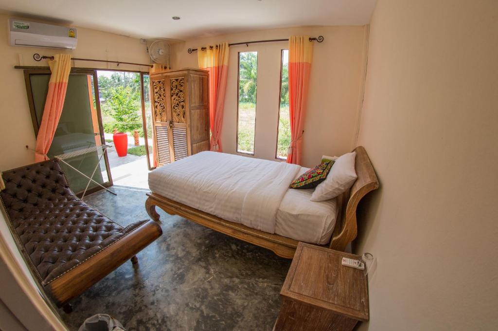 Postel nebo postele na pokoji v ubytování El Greco Bungalows Koh Lanta