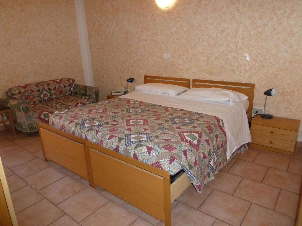 Postel nebo postele na pokoji v ubytování Hotel Bolognese