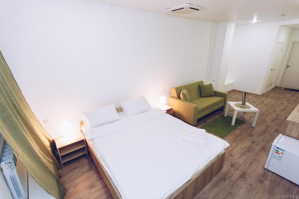 
Кровать или кровати в номере Отель Пешков
