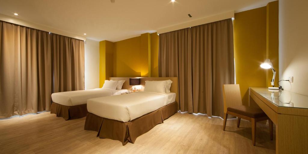 Postel nebo postele na pokoji v ubytování SGI Vacation Club Hotel