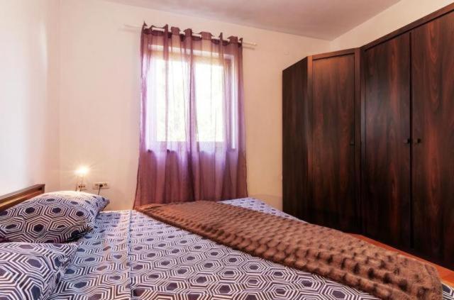 Łóżko lub łóżka w pokoju w obiekcie Apartments Andrej