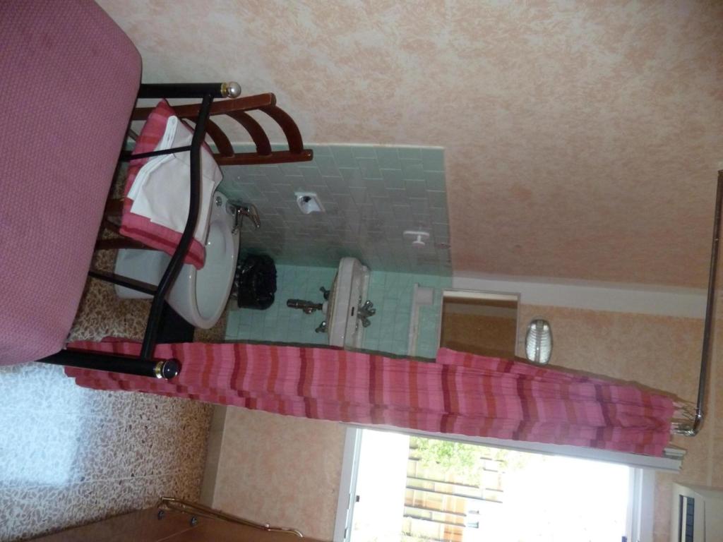 Postel nebo postele na pokoji v ubytování Hotel Bolognese
