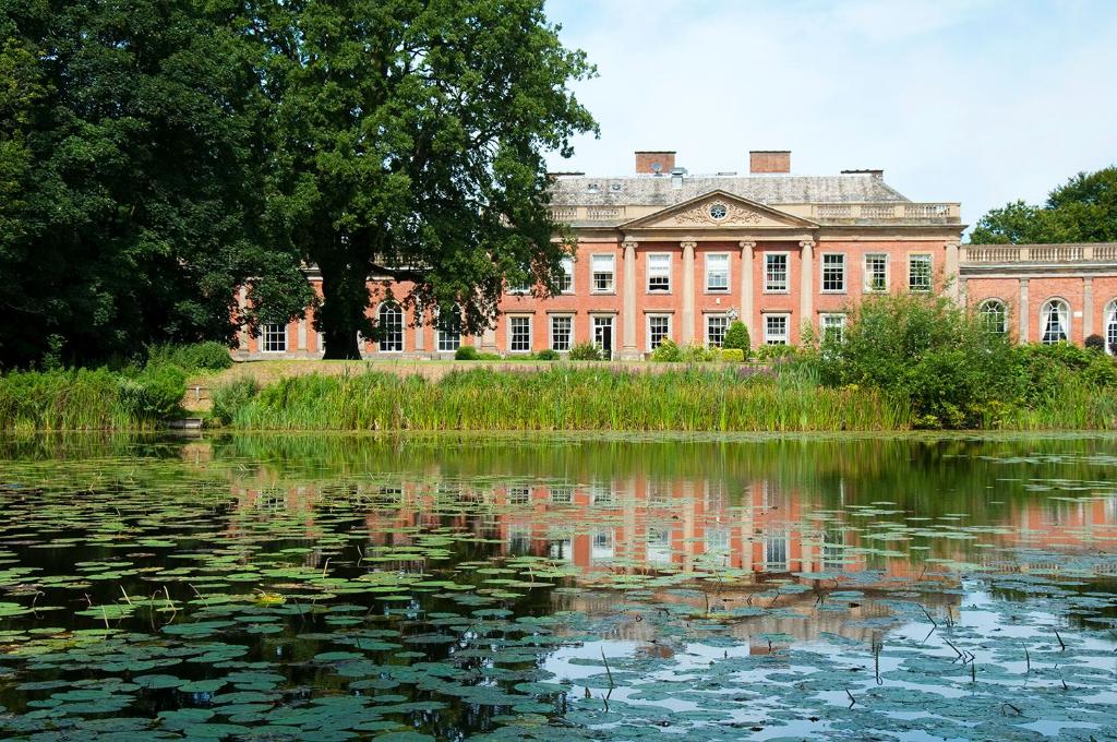 a large body of water surrounded by trees at Colwick Hall Hotel in Nottingham
