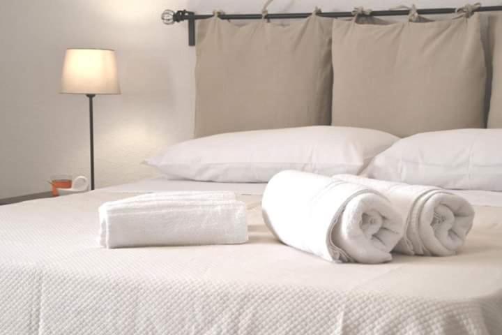 Postel nebo postele na pokoji v ubytování La Frantoiana