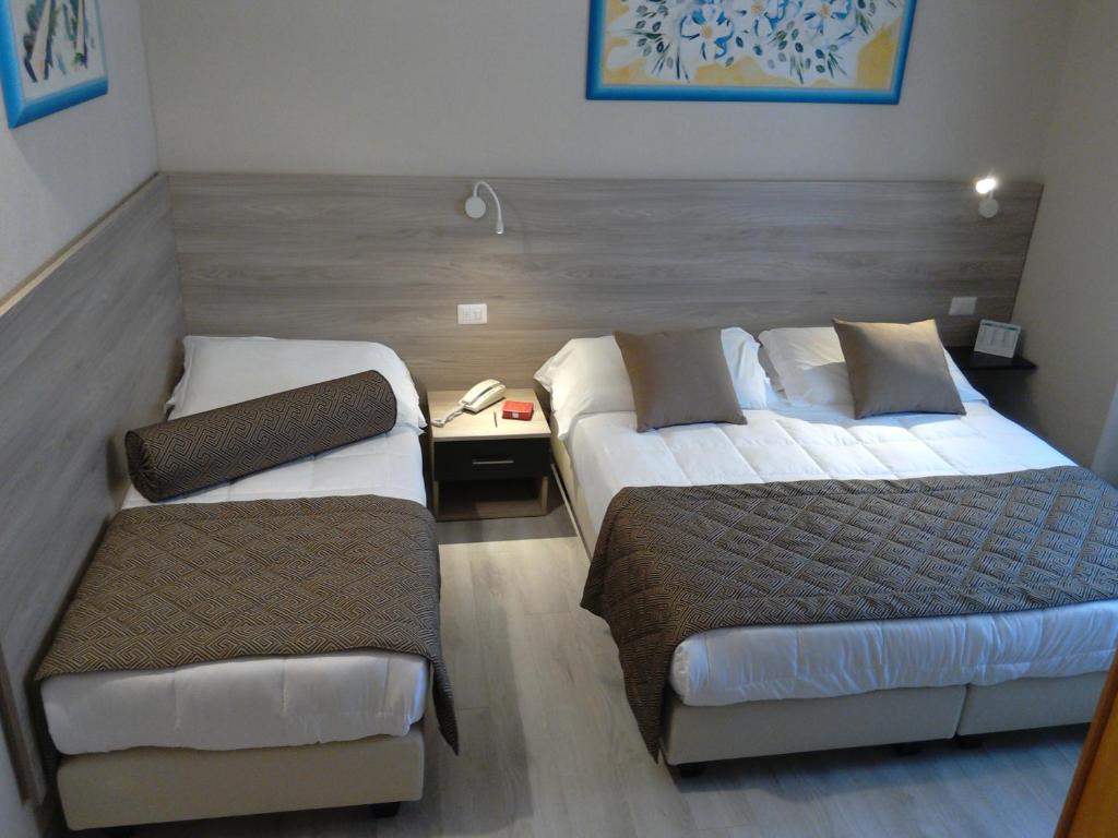 Postel nebo postele na pokoji v ubytování Hotel Citta'