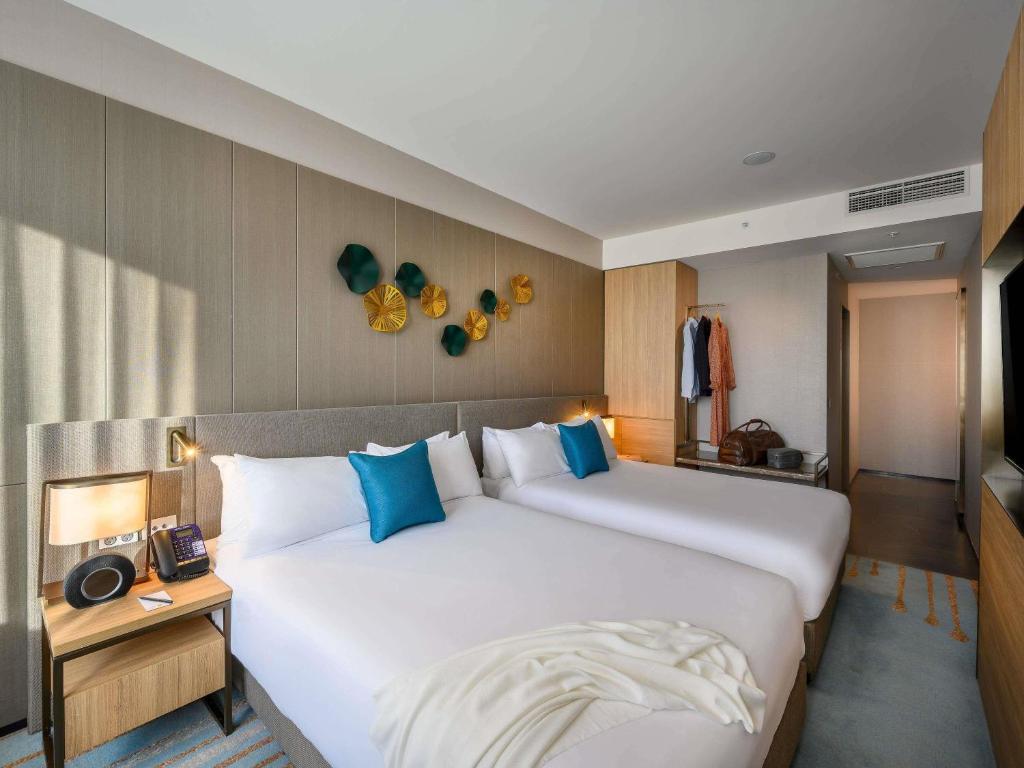 Travel Proud Sustainability certification Novotel Melbourne Central - Habitación Doble Deluxe Con Dos Camas Dobles