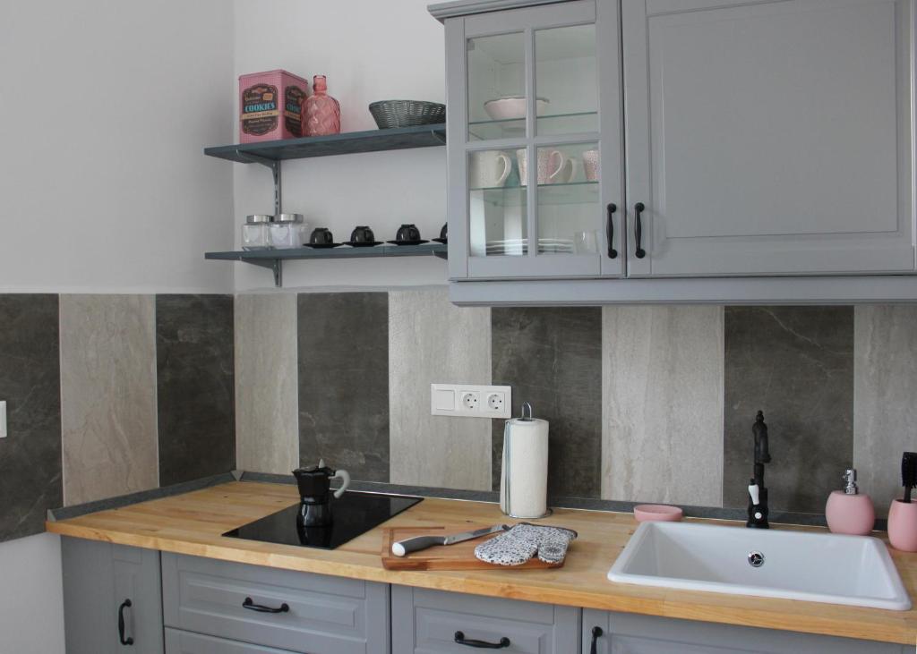 Kuchyňa alebo kuchynka v ubytovaní Óváros Apartman