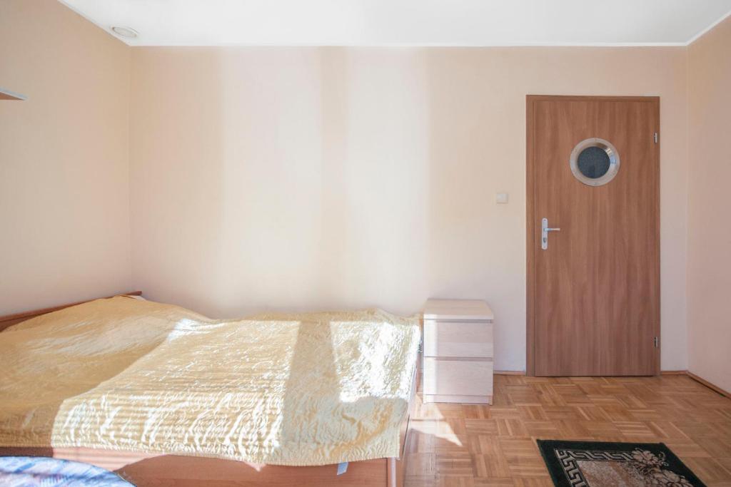 Postel nebo postele na pokoji v ubytování Roza Wiatrow