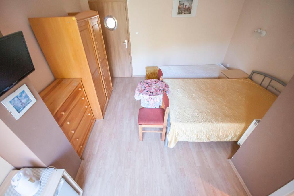 Postel nebo postele na pokoji v ubytování Roza Wiatrow