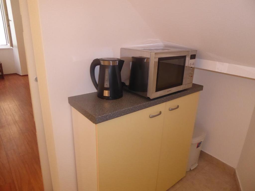 Kuchyň nebo kuchyňský kout v ubytování Studio Apartment Mila