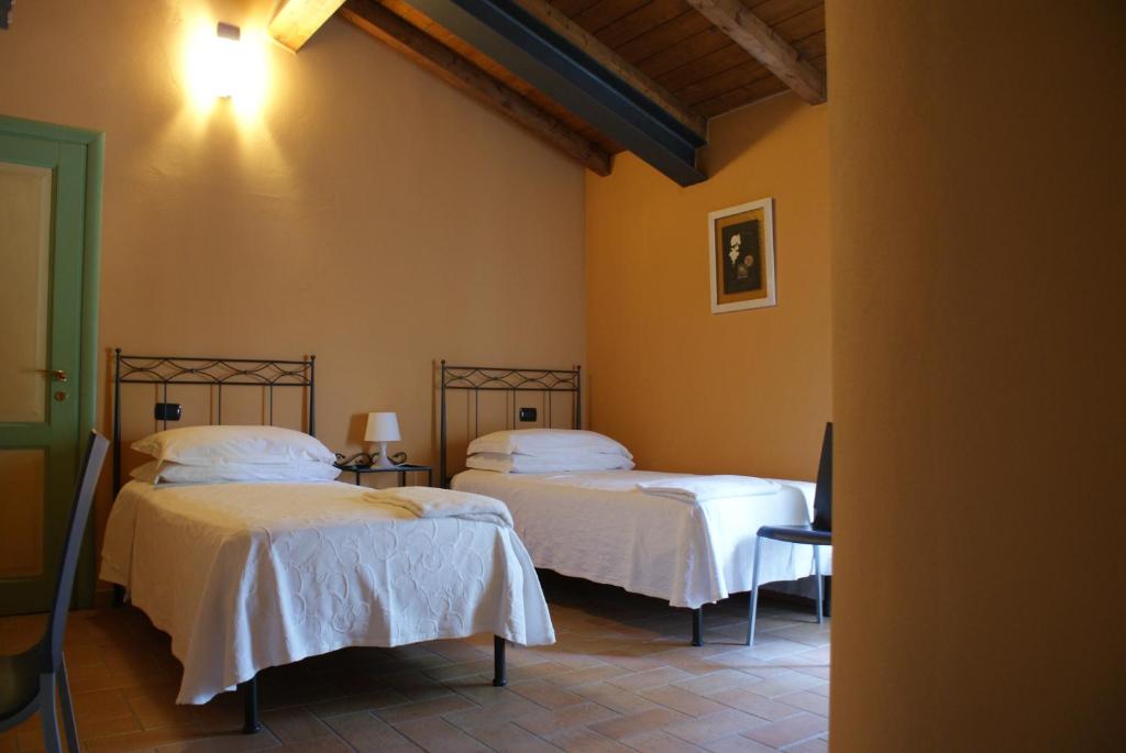 Ένα ή περισσότερα κρεβάτια σε δωμάτιο στο B&B Sant'Antonio