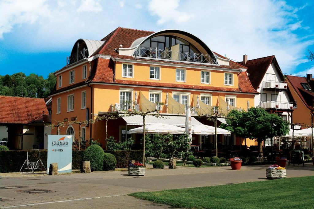 a large orange building with a round top at Hotel Seehof in Uhldingen-Mühlhofen