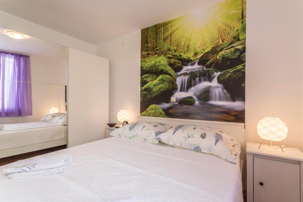 Postel nebo postele na pokoji v ubytování Apartment Petro Oldtown