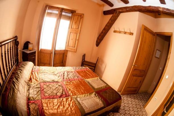 Postel nebo postele na pokoji v ubytování Apartaments Falset