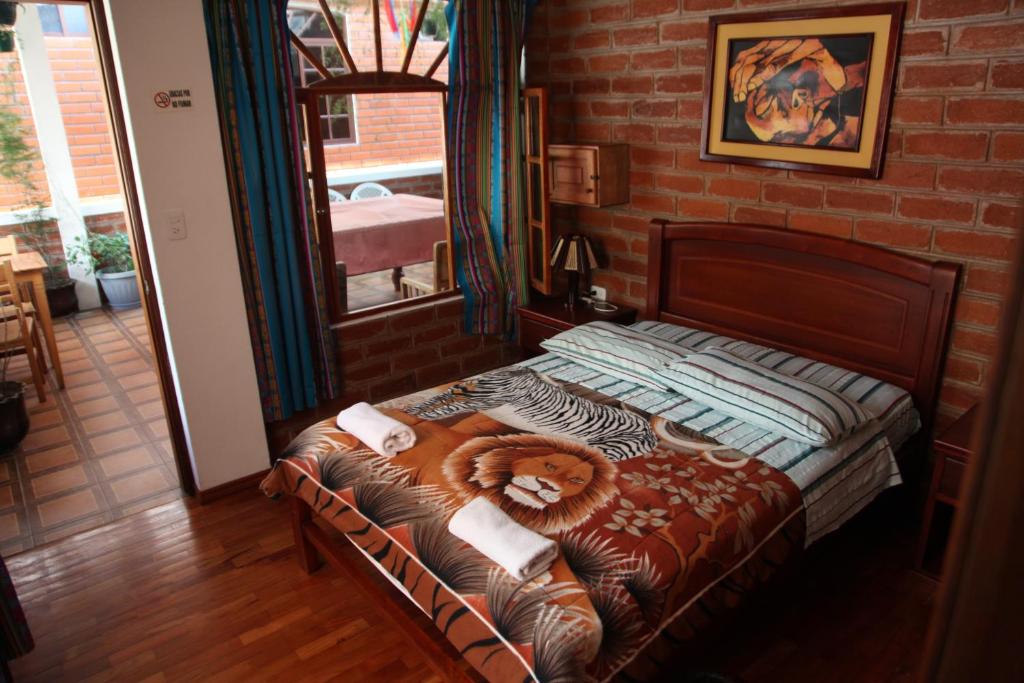 Postel nebo postele na pokoji v ubytování Hostal D´Mathias