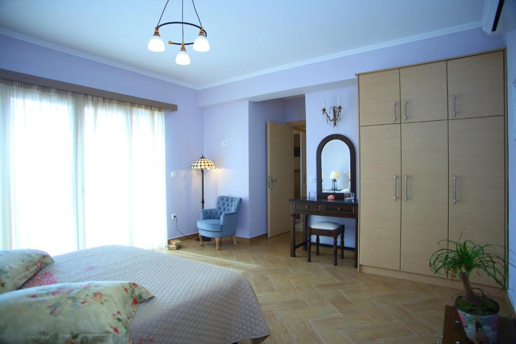 Postel nebo postele na pokoji v ubytování Villa Myrtis