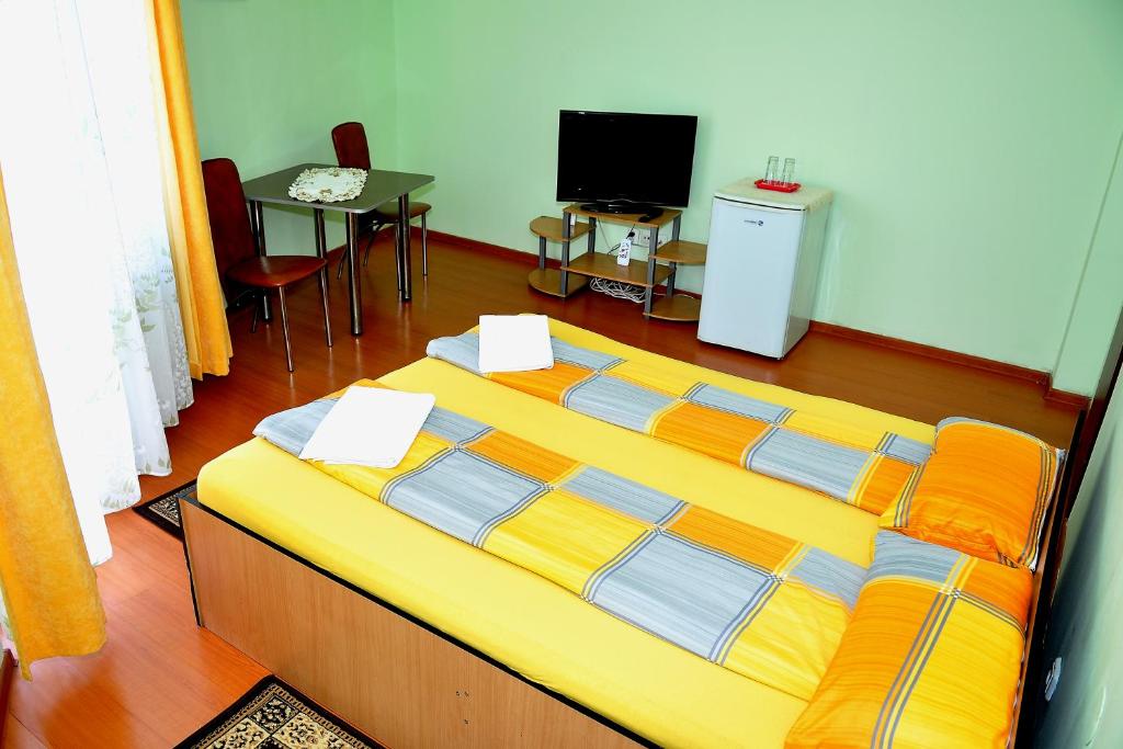Postel nebo postele na pokoji v ubytování Casa Otilia