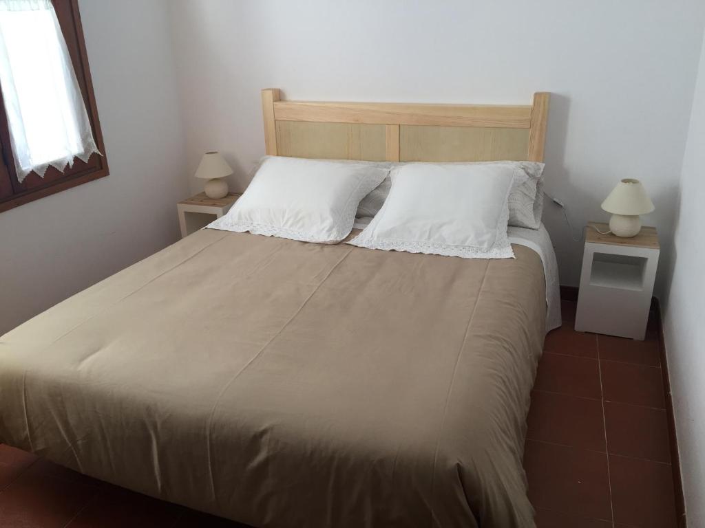 Postel nebo postele na pokoji v ubytování Casa Neus