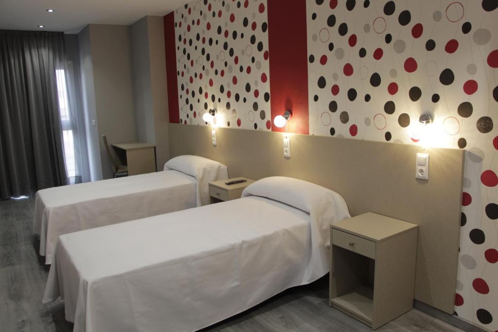 Postel nebo postele na pokoji v ubytování Hotel Siskets