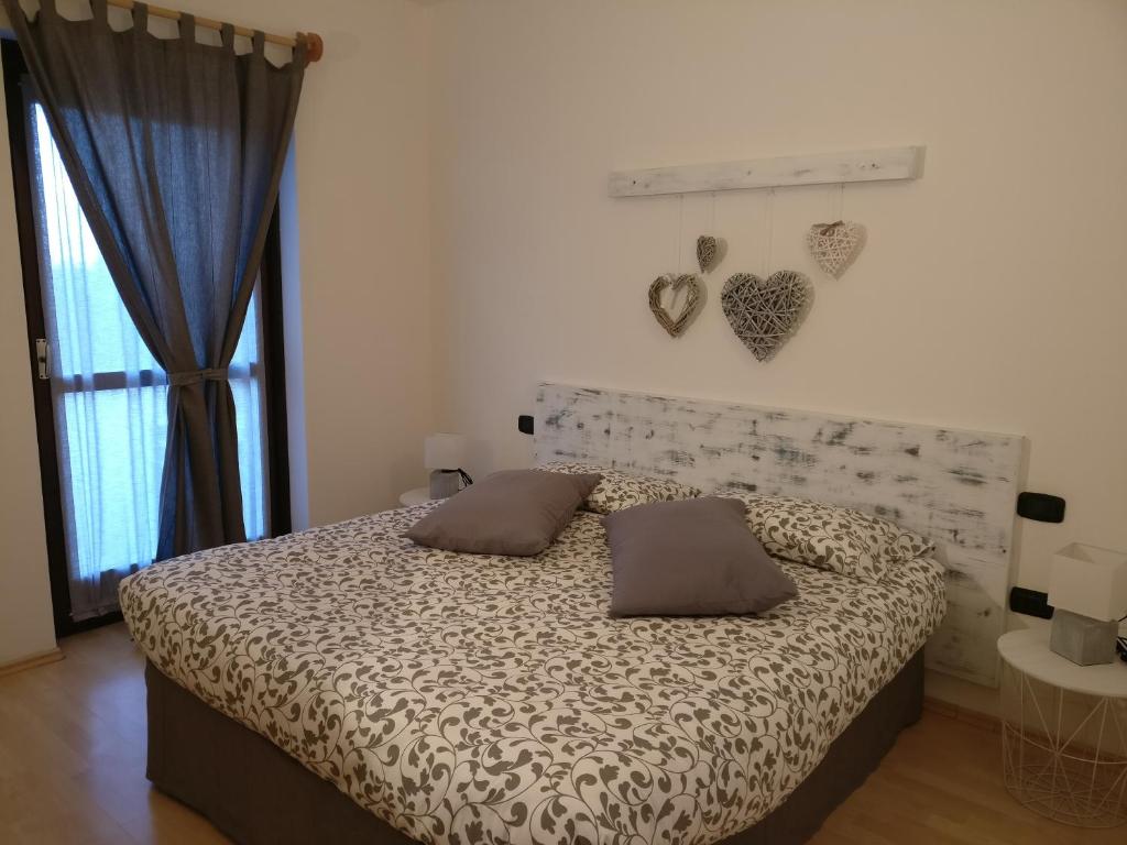 Postel nebo postele na pokoji v ubytování Garnì Al Laghet