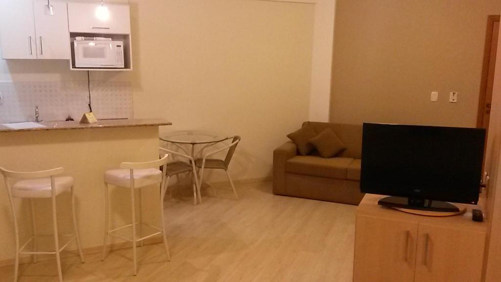 TV a/nebo společenská místnost v ubytování Itajubá Flat Hotel