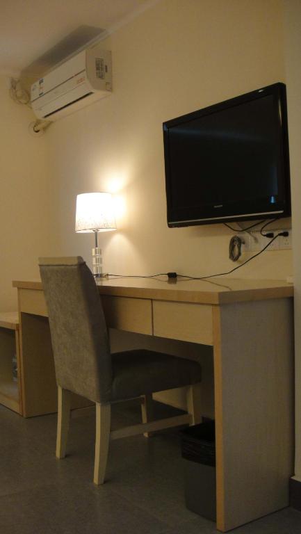 TV a/nebo společenská místnost v ubytování Guang Dong Hotel