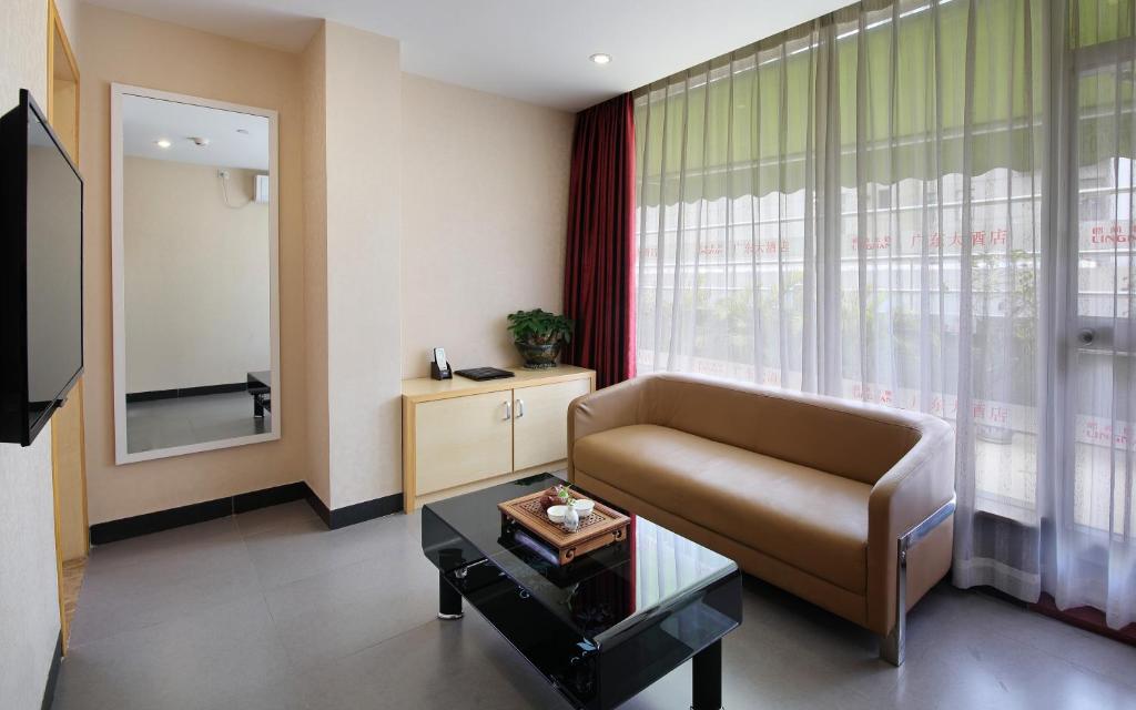 TV a/nebo společenská místnost v ubytování Guang Dong Hotel