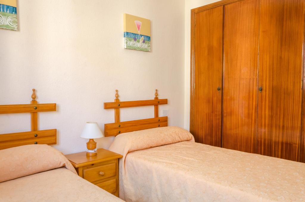 Postel nebo postele na pokoji v ubytování Apartamentos Tesy