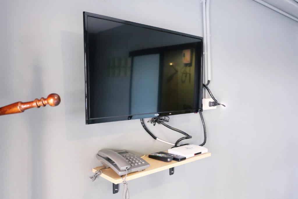TV a/nebo společenská místnost v ubytování Sleep Airport Chiang Mai