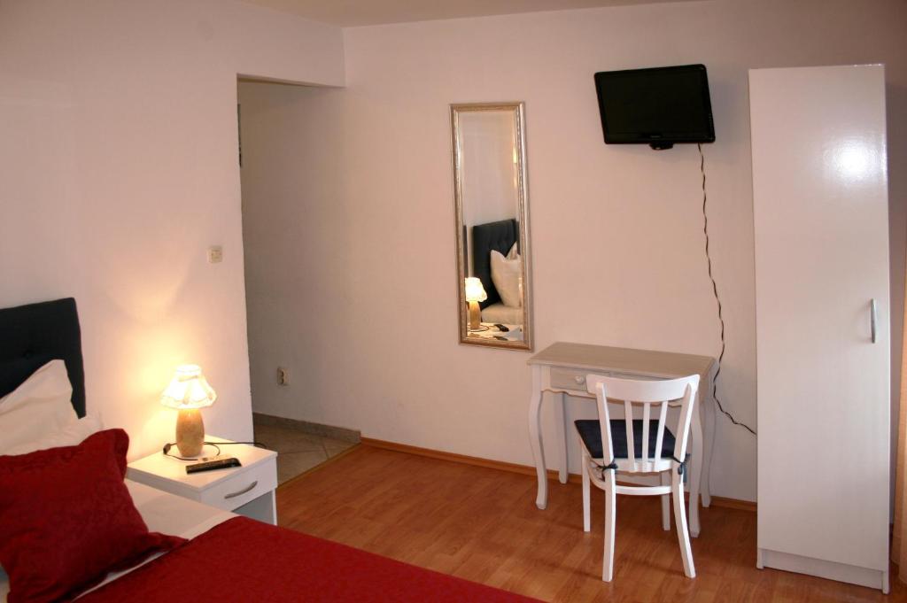 Postel nebo postele na pokoji v ubytování Rooms and Apartments Emily