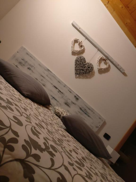Postel nebo postele na pokoji v ubytování Garnì Al Laghet