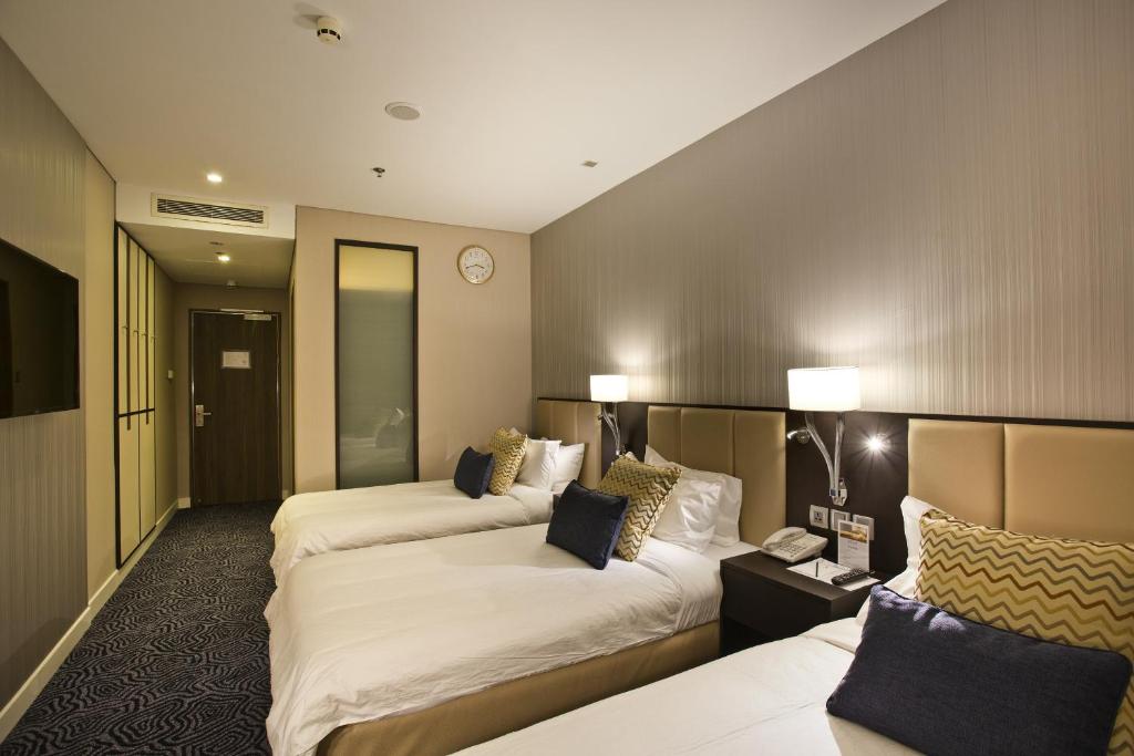 Postel nebo postele na pokoji v ubytování Ambassador Transit Hotel - Terminal 3