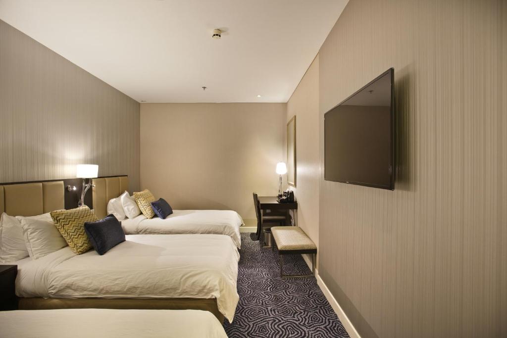 Postel nebo postele na pokoji v ubytování Ambassador Transit Hotel - Terminal 3