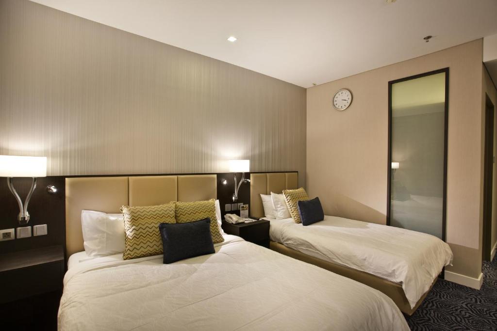 Postel nebo postele na pokoji v ubytování Ambassador Transit Hotel - Terminal 3