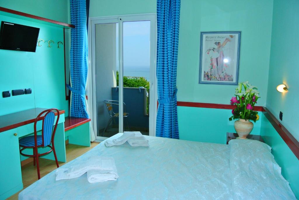Postel nebo postele na pokoji v ubytování Hotel Mirage