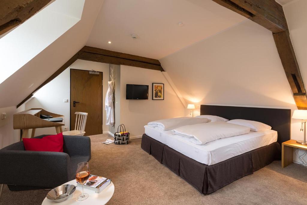 Ein Bett oder Betten in einem Zimmer der Unterkunft Hotel Deutschherrenhof