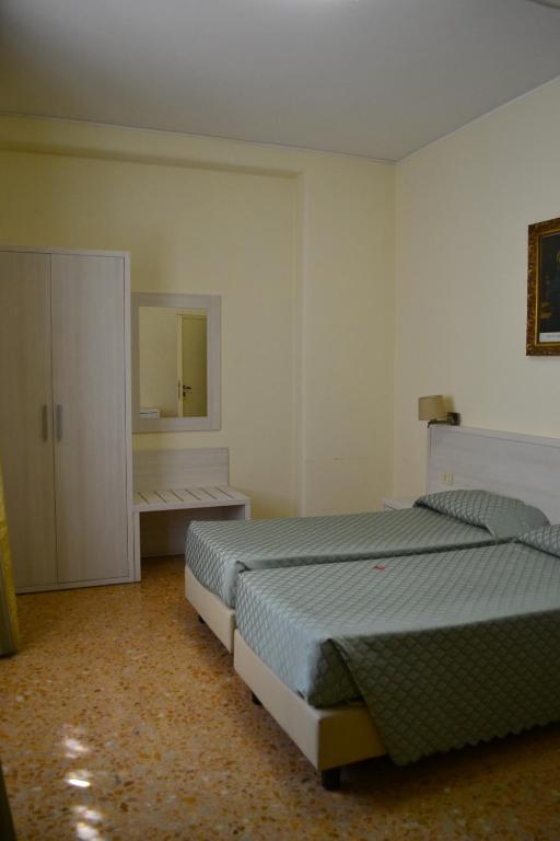 Łóżko lub łóżka w pokoju w obiekcie Casa per Ferie Ravasco San Pietro