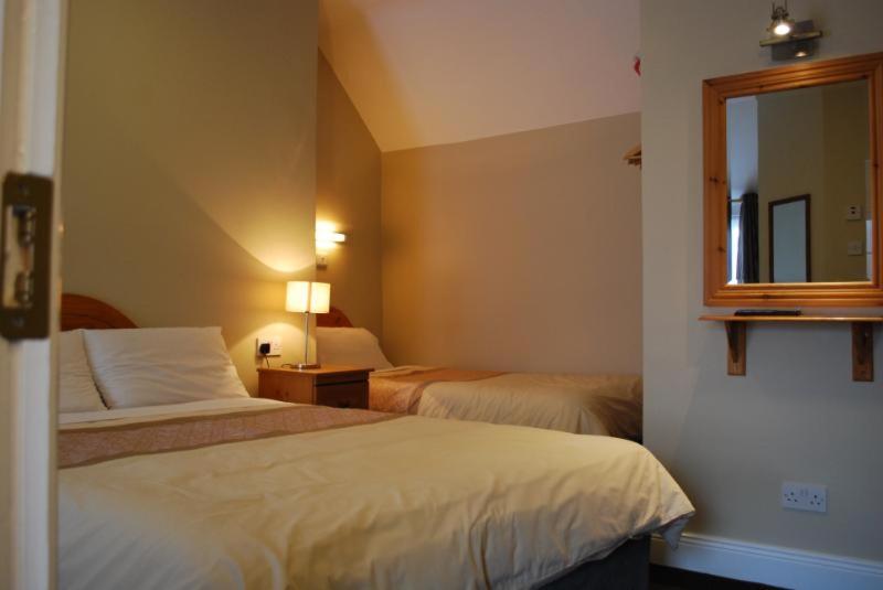 Postel nebo postele na pokoji v ubytování Parkway Guesthouse