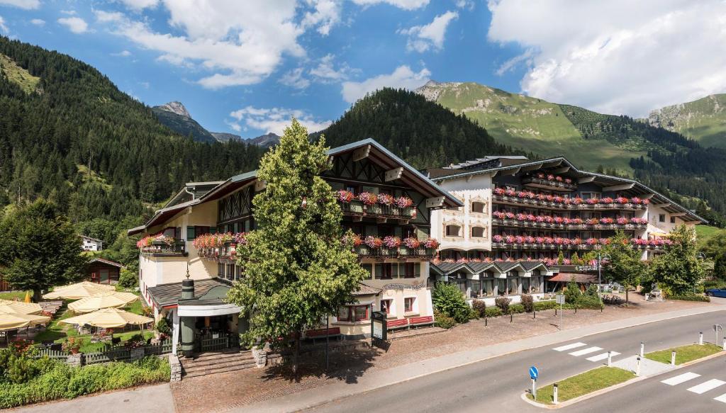 an aerial view of a hotel in the mountains at Alpenrose Wellnesshotel in Elbigenalp