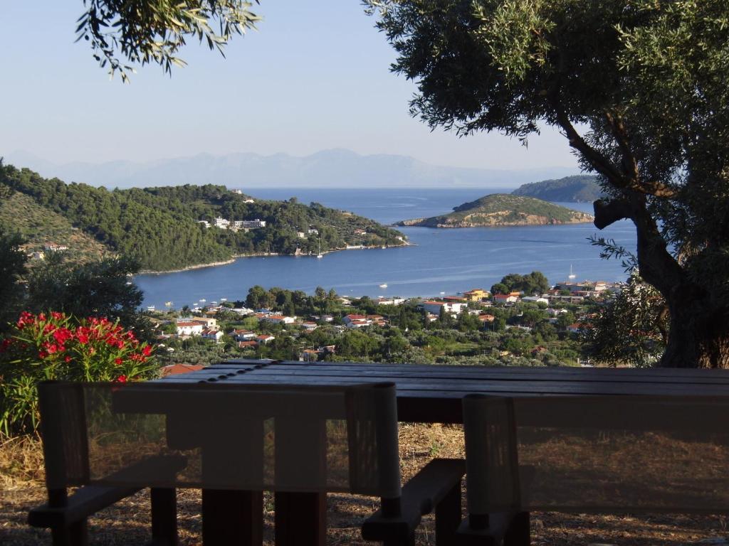 a view of a lake from a park bench at Villas Zoe in Skiathos