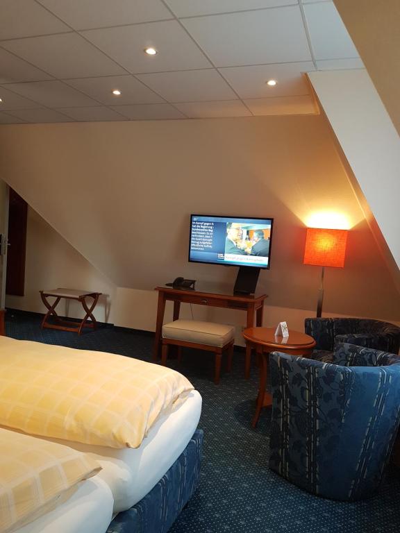 TV a/nebo společenská místnost v ubytování Dünenhotel am Meer