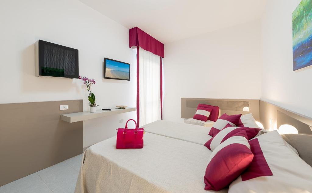 A bed or beds in a room at Zenit Hotel