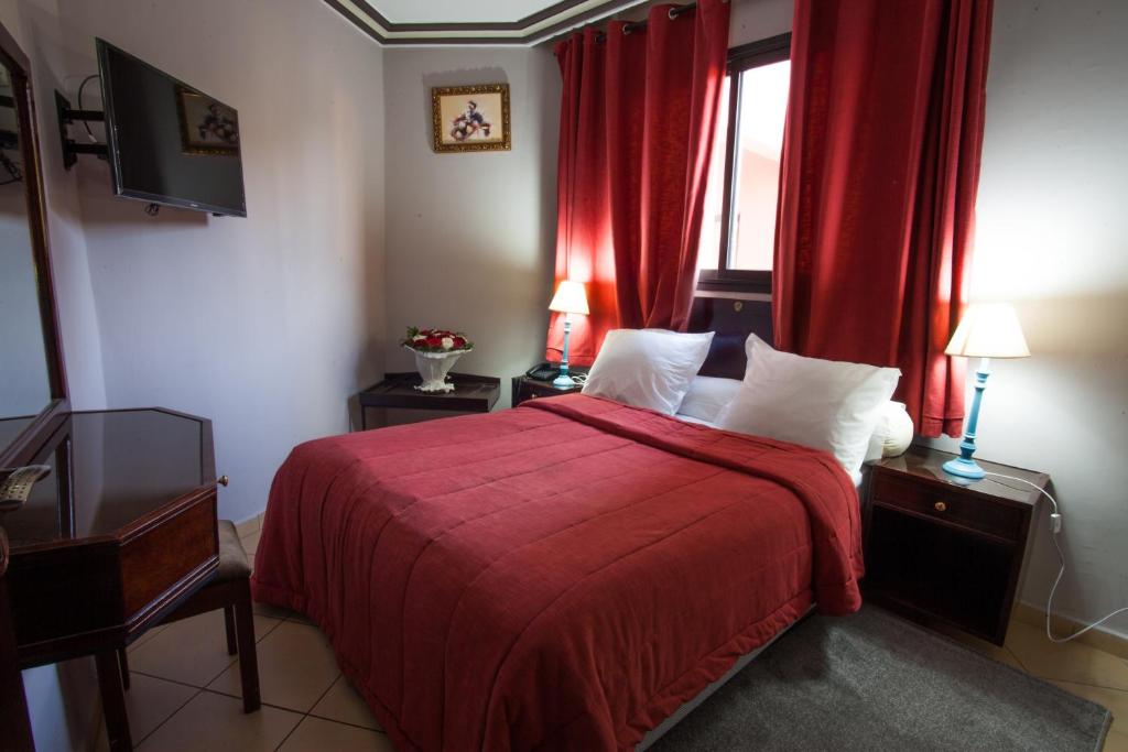 Postel nebo postele na pokoji v ubytování Residence Hotel Assounfou