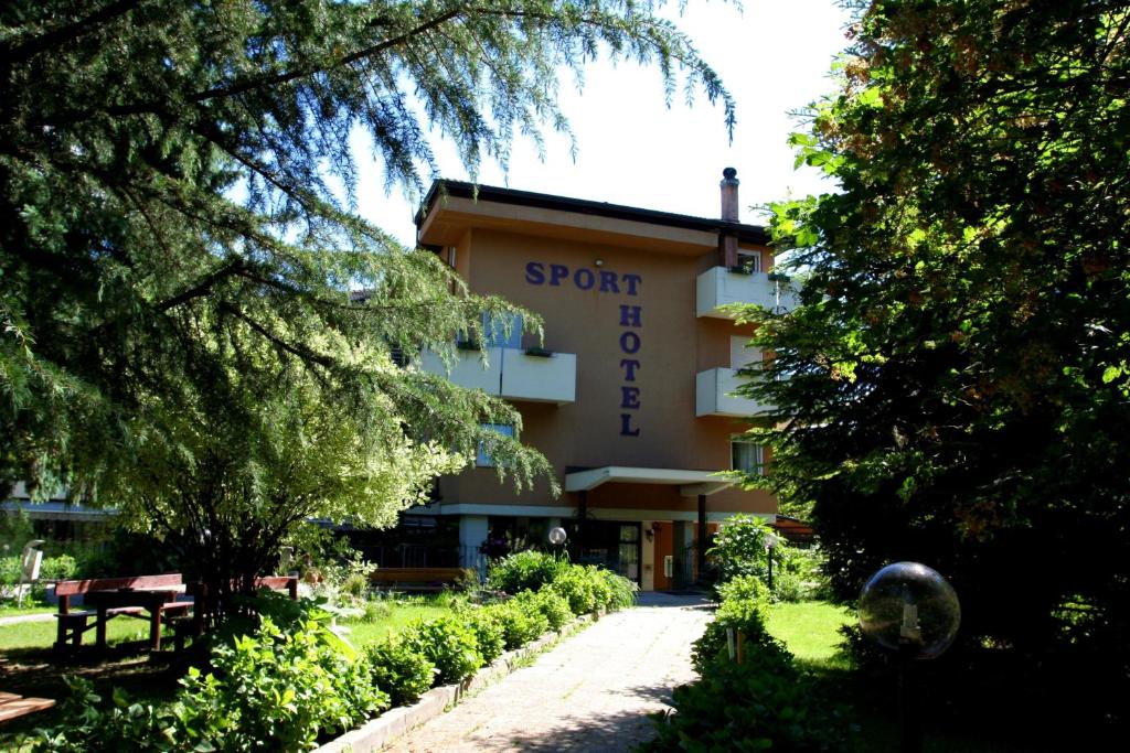 a building with a sign that reads sport hotel at Hotel Sport - Pet friendly hotel and fishing lovers in Levico Terme