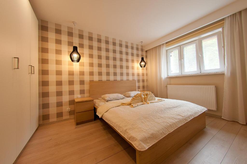 Postel nebo postele na pokoji v ubytování Apartamenty Przy Świerku