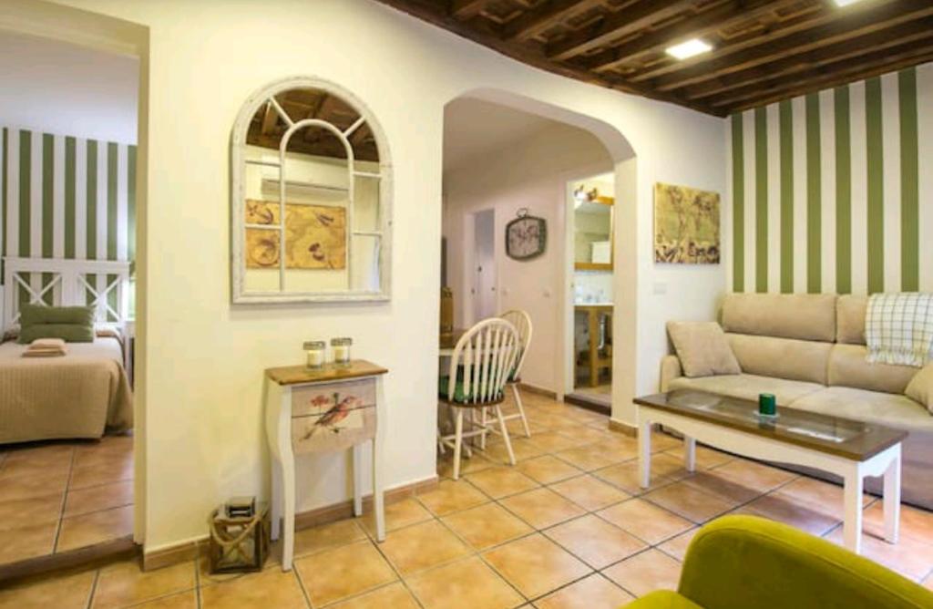 a living room with a couch and a table at Apartamento Alfileritos XX in Toledo